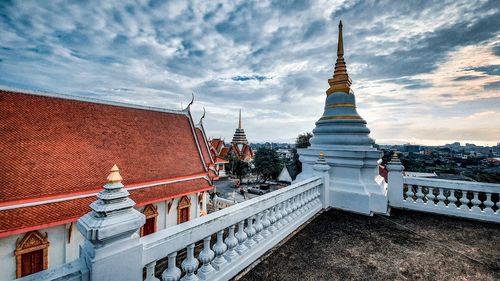 View of temple building against cloudy sky