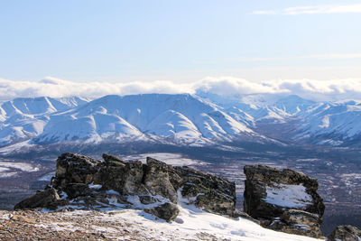 Scenic view of snowcapped mountains against sky