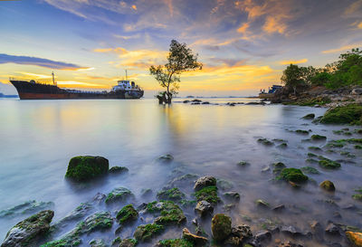 Scenic view of sea against sky during sunset