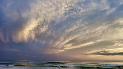 Scenic view of sea against sky at sunset