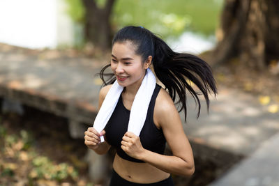 Young woman using mobile phone outdoors