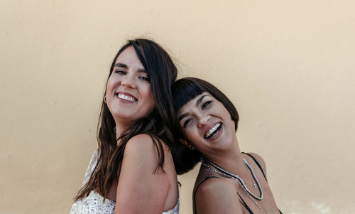 Portrait of two beautiful happy young women.