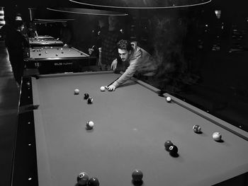 Man playing with ball on table