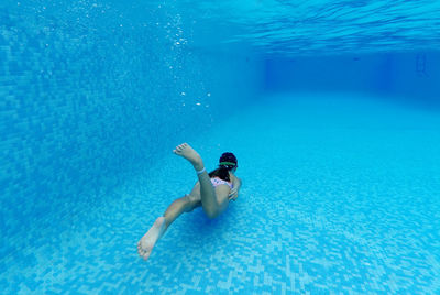 Man swimming in pool