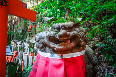 Close-up of statue against plants