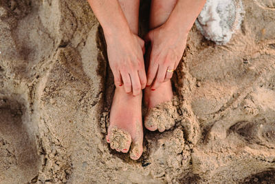 Low section of woman at beach