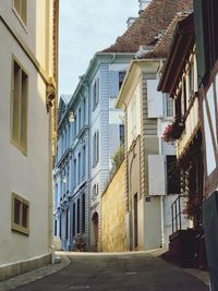 Empty alley amidst buildings in town