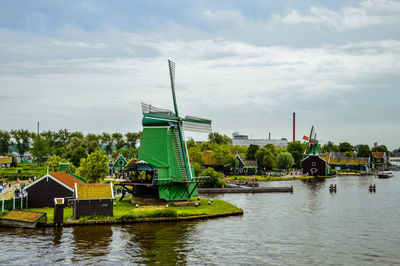 Traditional windmill against sky