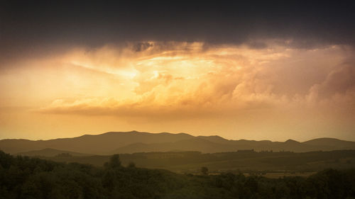 Scenic view of landscape against sky during sunset