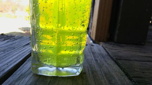 Close-up of yellow drink on table