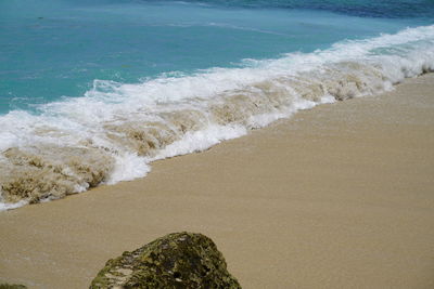 High angle view of surf on beach