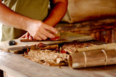 Midsection of man preparing food