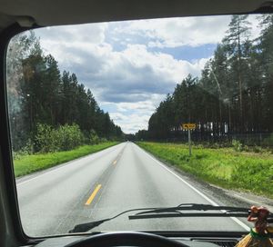 Road seen through car windshield