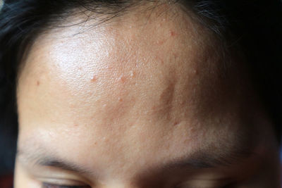 Close-up of man eye against black background