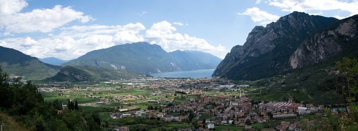 Scenic view of village and houses against sky