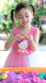 Portrait of cute baby girl eating food