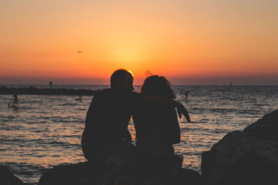 Rear view of couple at sunset