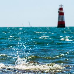 Scenic view of sea against blue sky