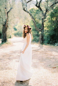 Midsection of bride holding bouquet