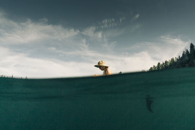 A young woman enjoys a standup paddle board on lost lake in oregon.