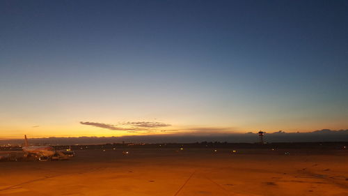 View of city against sky during sunset