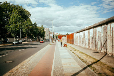 Cars on road against sky