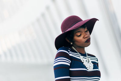 Fashionable woman wearing maroon hat