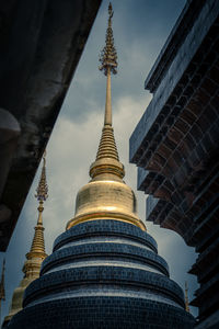 Low angle view of pagoda against buildings