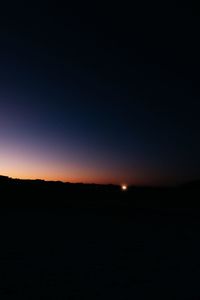 Scenic view of silhouette landscape against clear sky at sunset