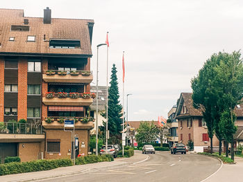 Street amidst buildings against sky