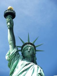 Statue of liberty against blue sky