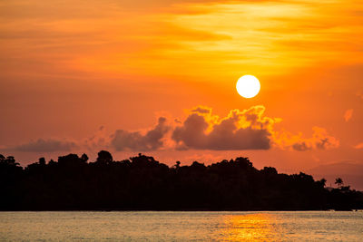 Scenic view of sea against romantic sky at sunset