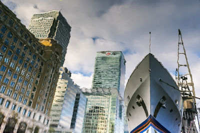 Low angle view of buildings against sky in city