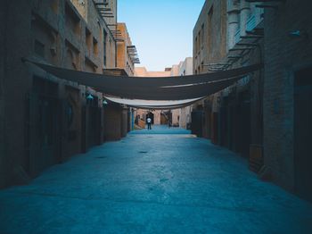 Narrow alley amidst buildings in city