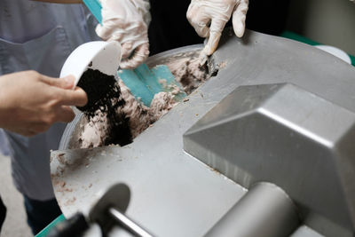 Midsection of man working on table