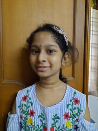 Portrait of smiling girl at home