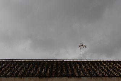 Low angle view of roof against sky