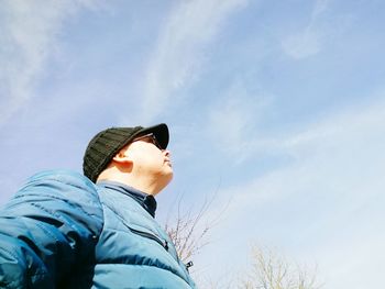 Low angle view of man against sky