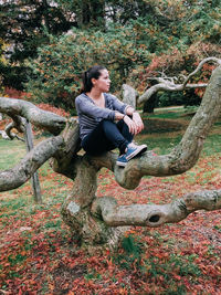 Rear view of woman standing in park