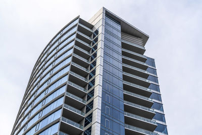 Low angle view of modern building against sky