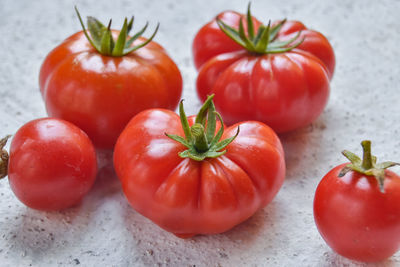 Detail of fresh tomatoes on white background