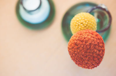 High angle view of craspedia in vase on table