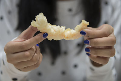 Close-up of hand holding ice cream