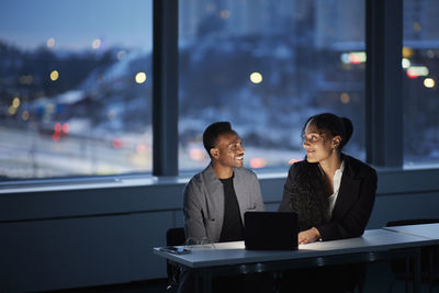 Colleagues working late in office