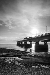 Bridge over sea against sky