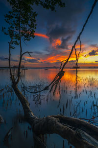 Scenic view of lake against romantic sky at sunset