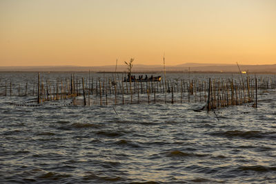 Scenic view of sea against clear sky during sunset