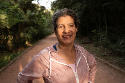 Portrait of smiling woman standing outdoors