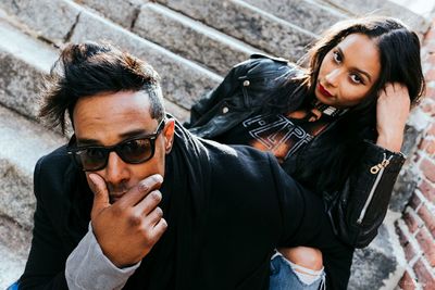 Portrait of couple sitting on steps