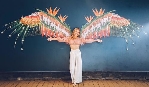 Full length of woman standing against sky